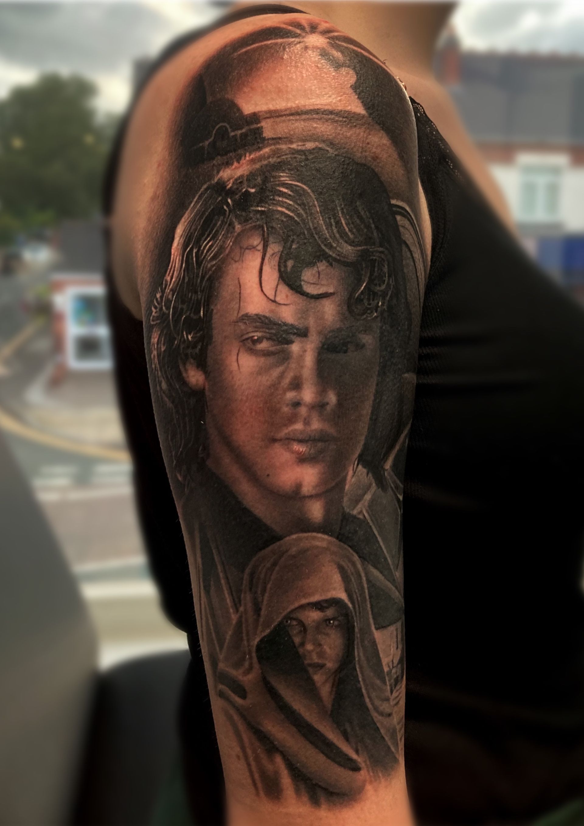 A woman has a tattoo of anakin skywalker on her arm
